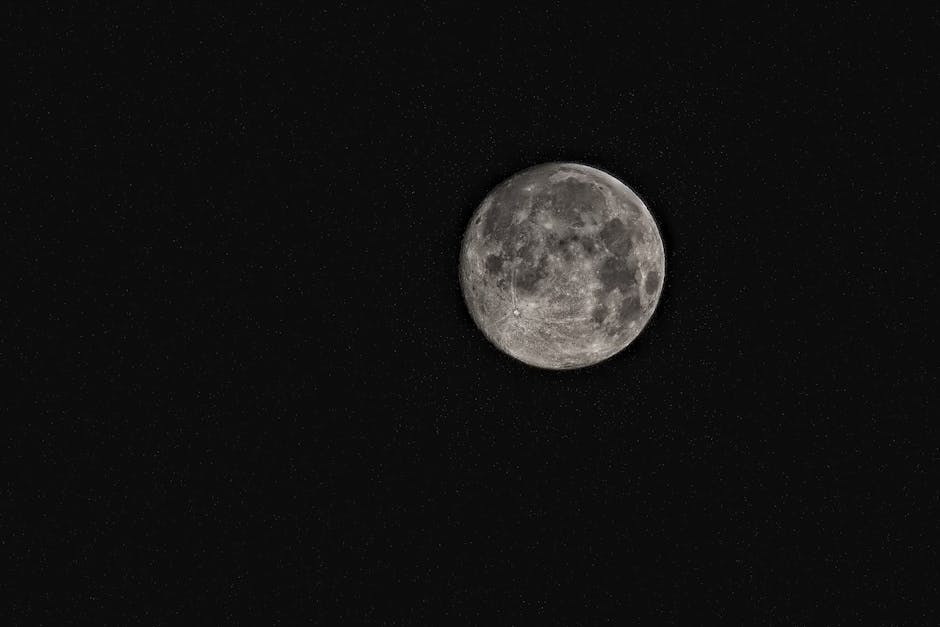 Bright full moon in a starry night sky